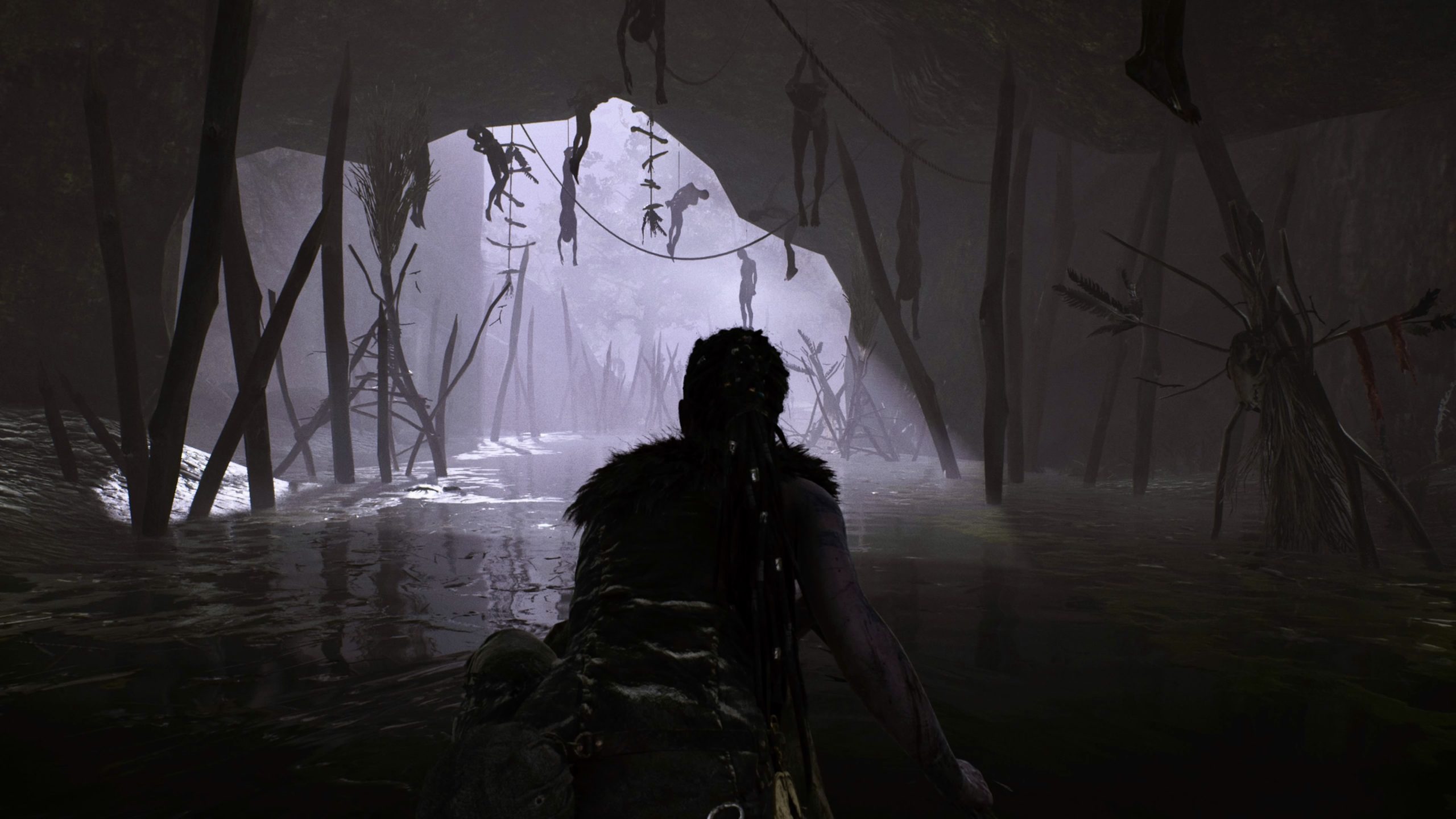 The player-character, Senua, in the game Hellblade (screenshot).